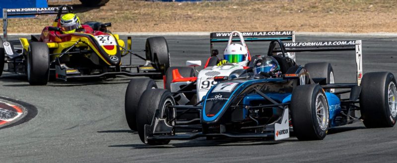 Car 7 leads 99 and 27 out of turn 2 Queensland Raceway during a formula 3 race